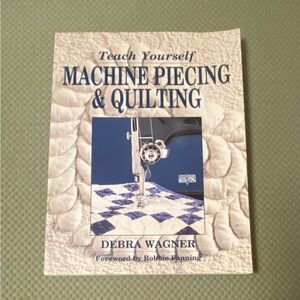 “Teach Yourself Machine Piecing & Quilting” large paperback book.